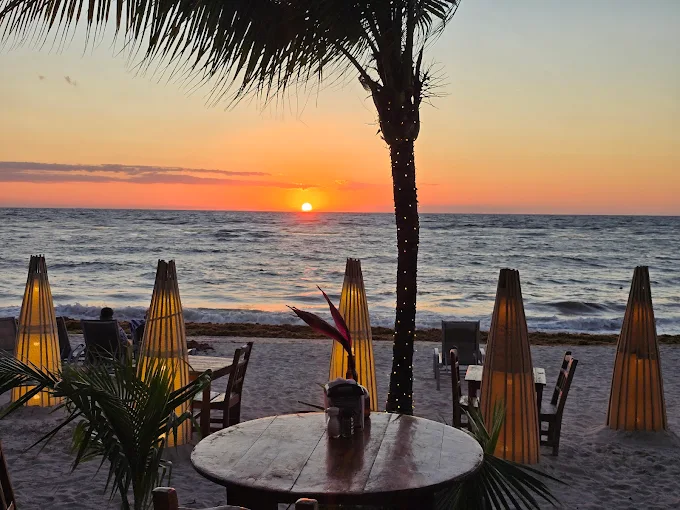 Argentinian Grill · sunset on West Bay beach